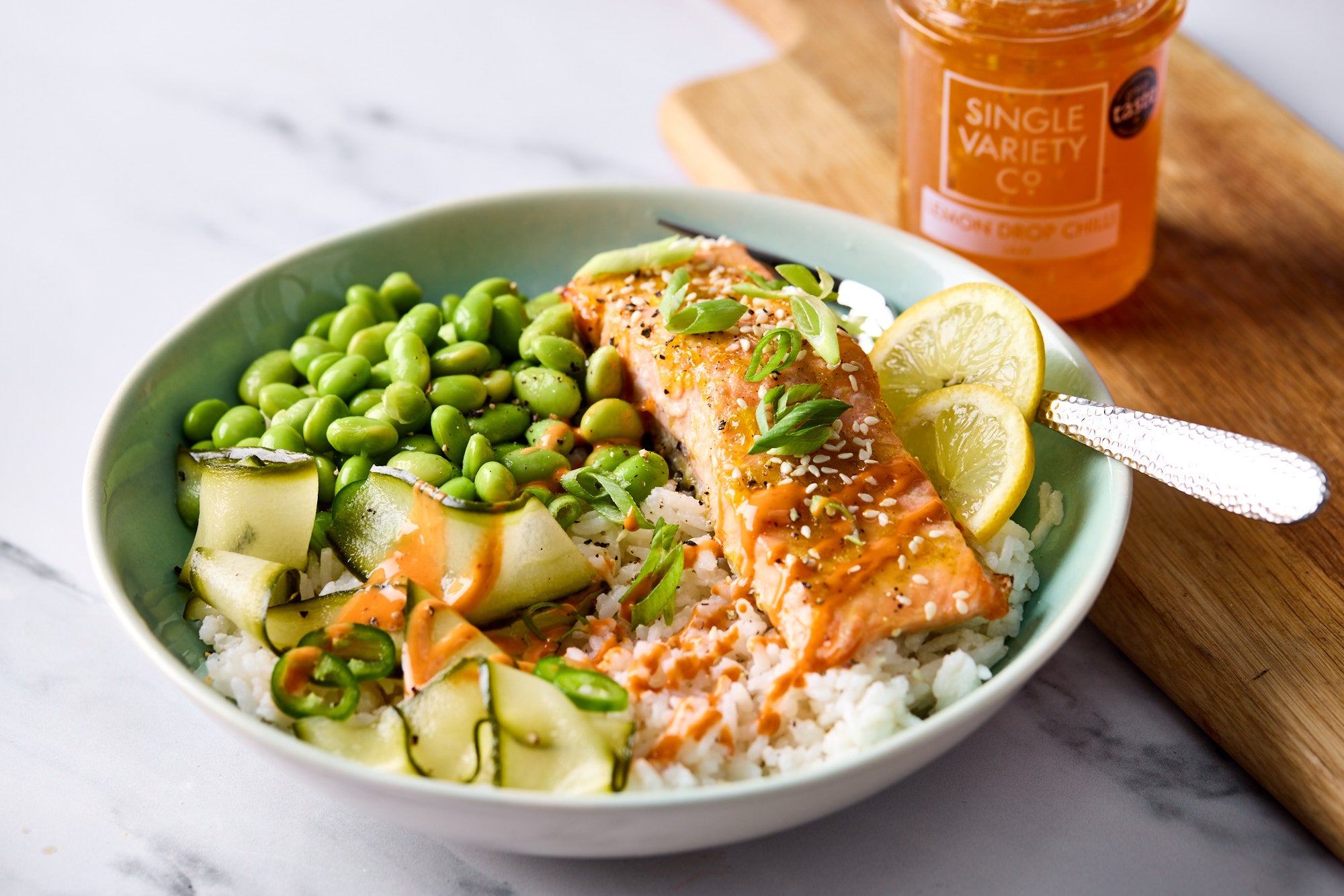 Lemon Drop Spicy Salmon with Pickled Cucumber, Sticky Rice & Edamame